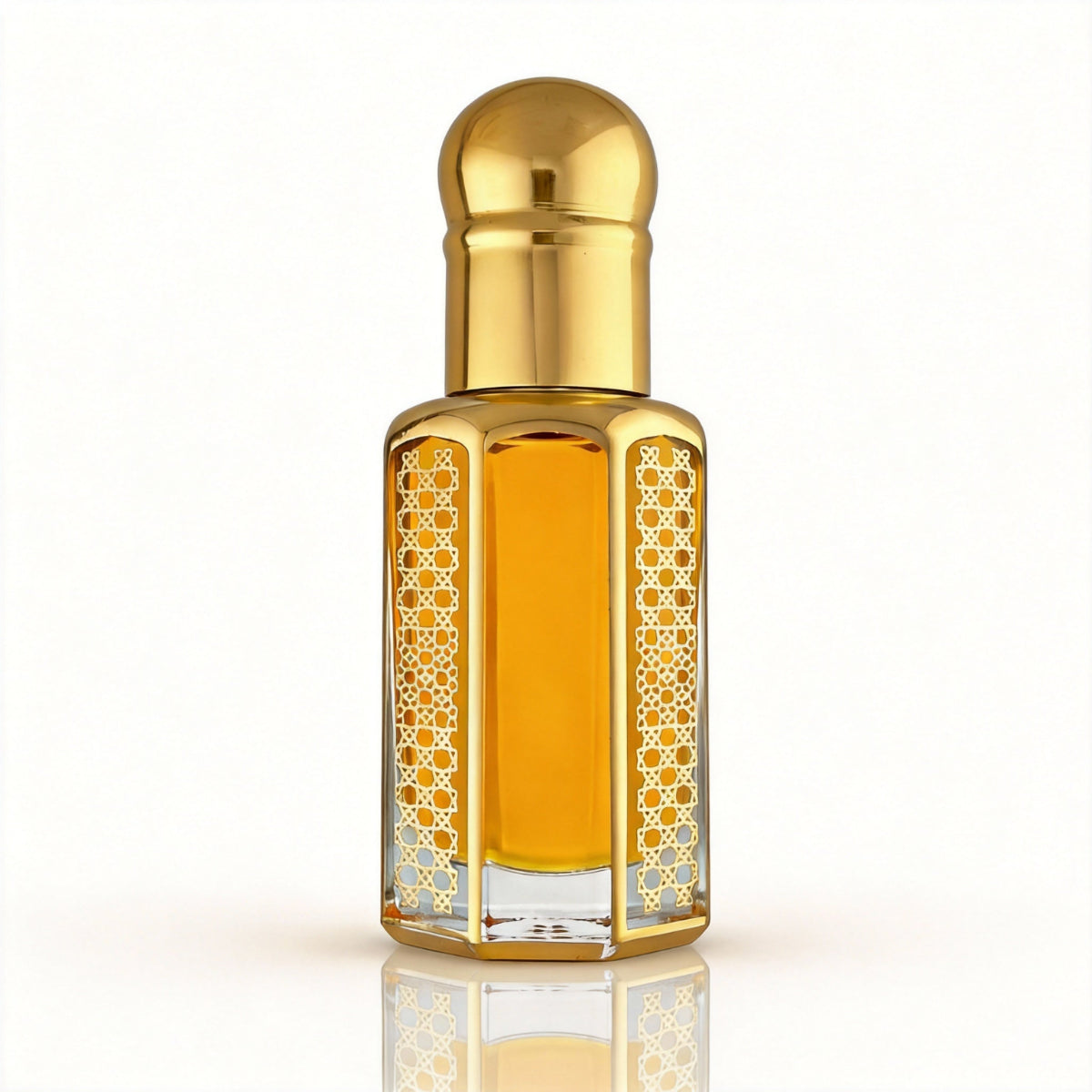 Ombre Nomade inspired perfume oil in a luxury gold bottle on a white background, showcasing its yellow-orange oil color.