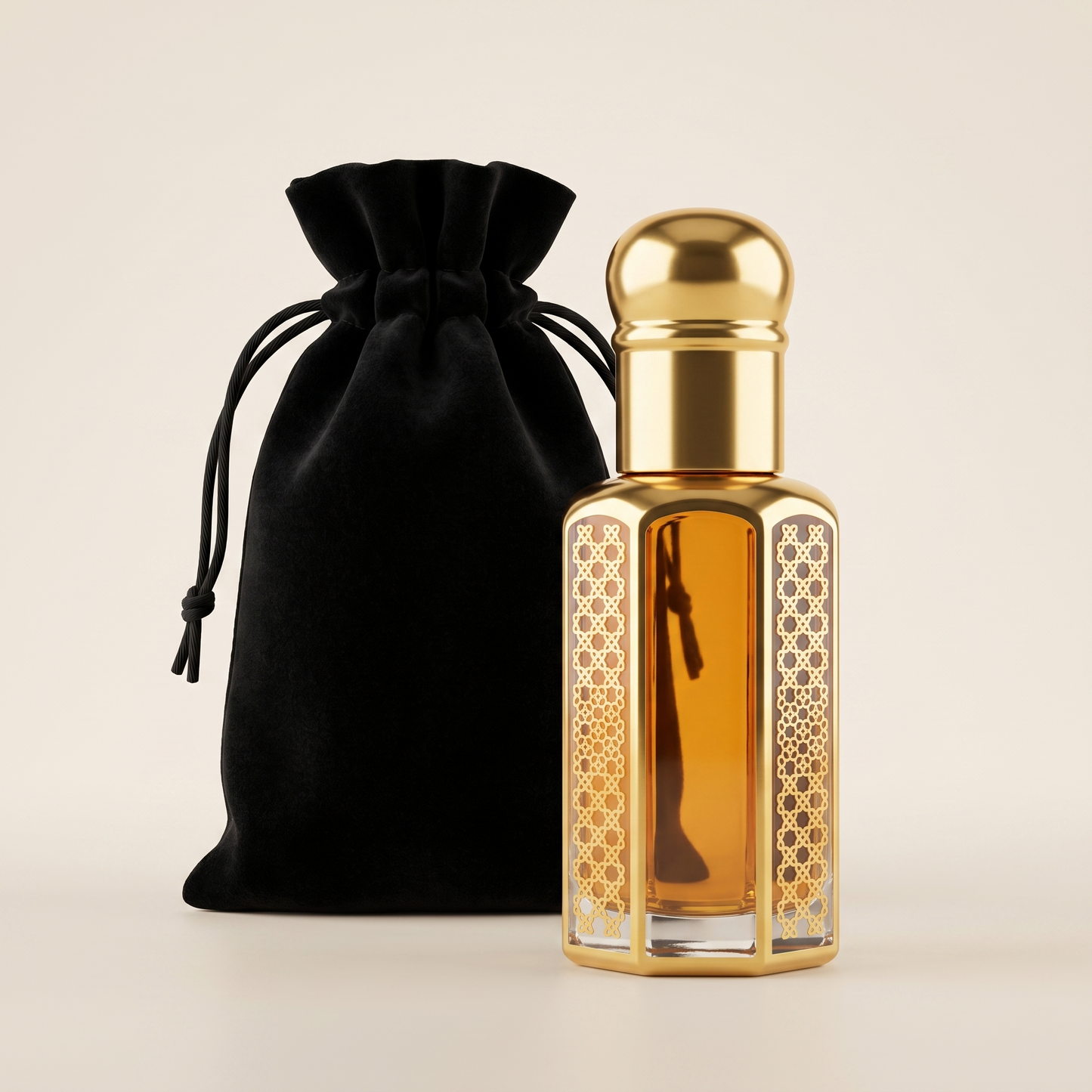 OudSpot Ombre Nomade inspired perfume oil in an ornate gold bottle with a premium black velvet drawstring pouch